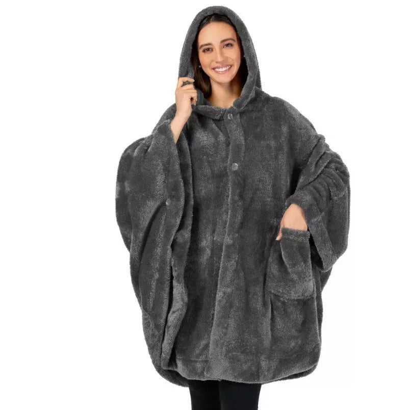 Thick hooded long sleeve bathrobe in black hanging on a hook