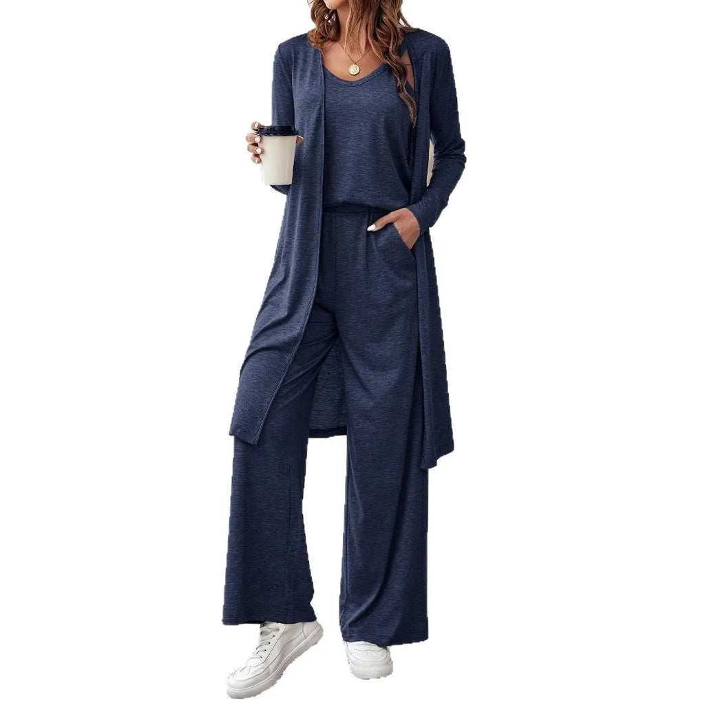Blue women's three-piece casual suit set featuring trousers, a long-sleeve top, and suspenders on a hanger.