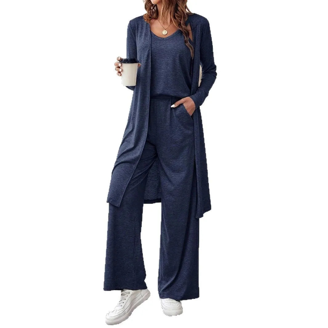 Blue women's three-piece casual suit set featuring trousers, a long-sleeve top, and suspenders on a hanger.