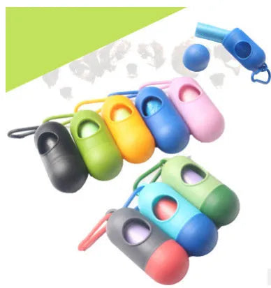 A small black plastic dog poop bag holder with a hook and Velcro strap, shown next to a roll of bags.