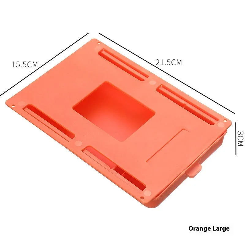 Adhesive under table storage drawer in plastic with covered grid design, shown in grey colour