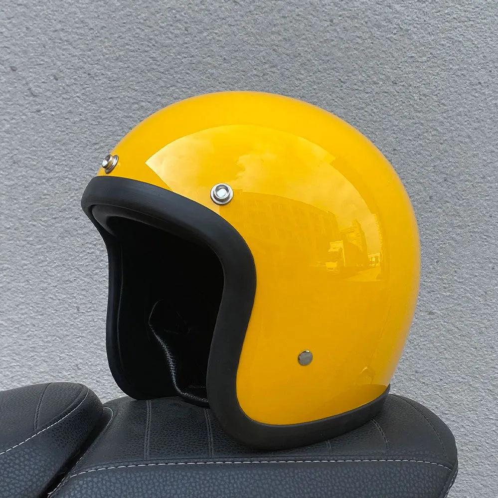 Glass fibre retro half motorcycle helmet shown in multiple colour options including cement grey and matte black flower patterns