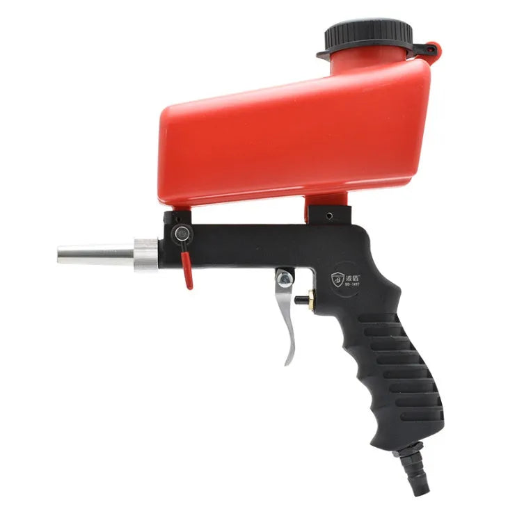 Portable black pneumatic sandblasting gun with tank and nozzle for rust removal.