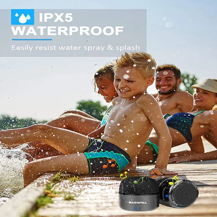 Black waterproof mini Bluetooth speaker with button controls and USB charging port