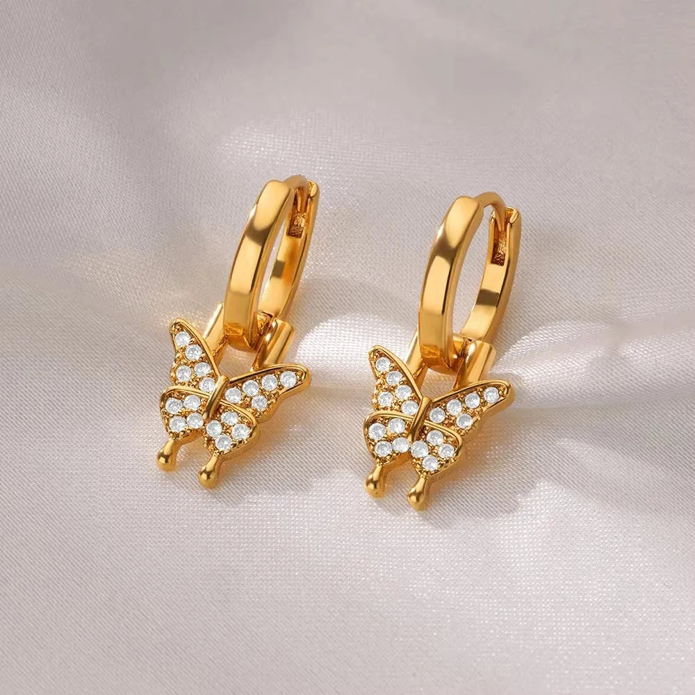 Geometric butterfly earrings for women in copper alloy with heart, bow, and star shapes.