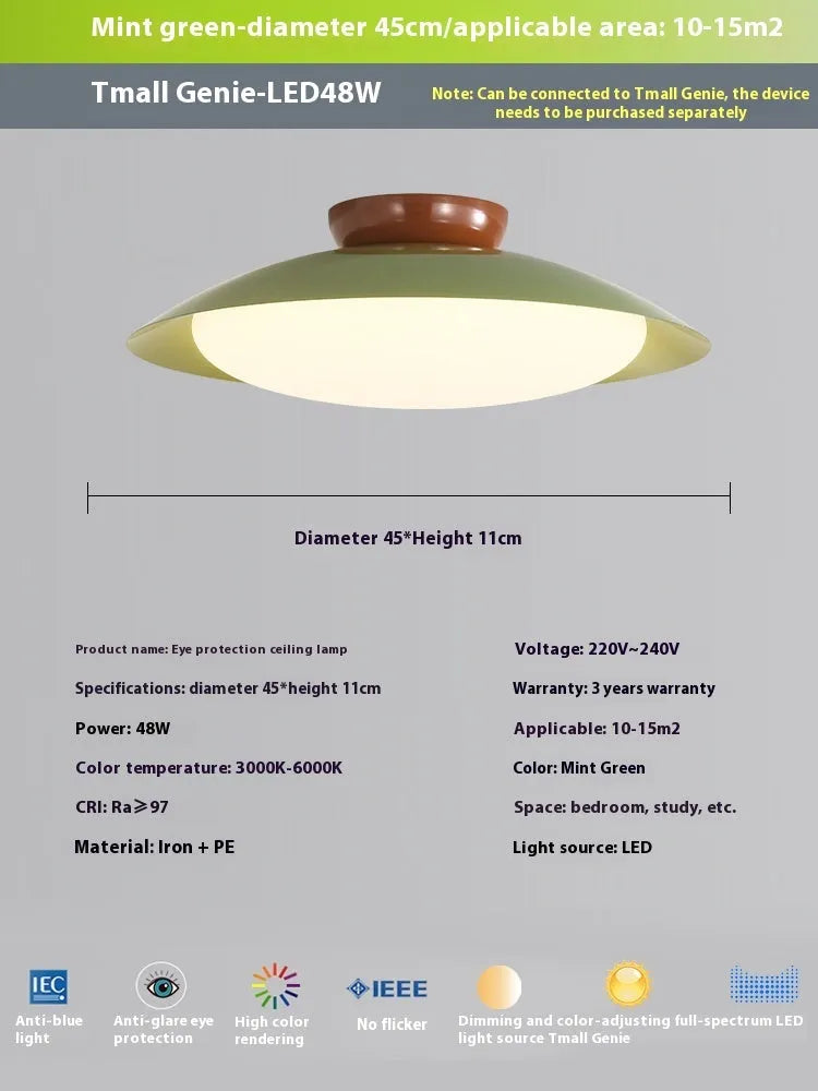 Modern flying saucer shaped ceiling lamp with an iron shade, shown in a cream yellow finish.