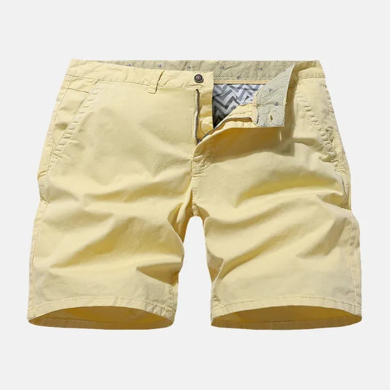 Blue denim men's shorts with printed design, loose fit, and no belt on a mannequin.