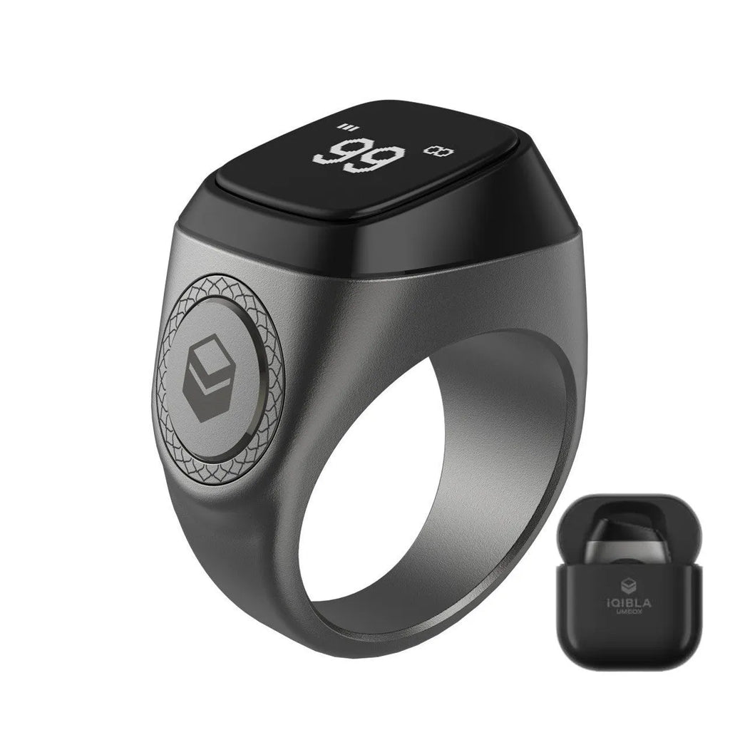 Zikr1 smart ring showing OLED display with time and count, metal body, on a finger.