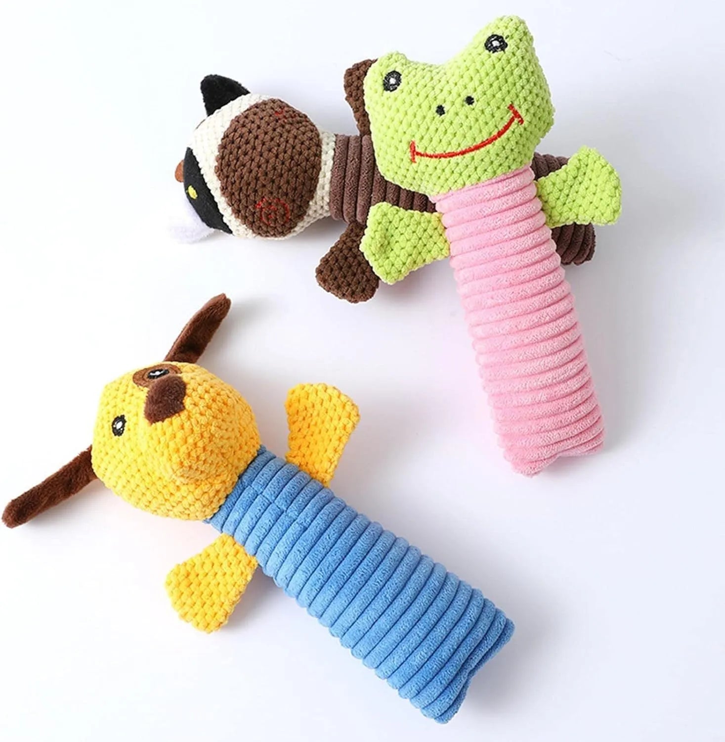 A cloth stuffed animal dog chew toy with a squeaker, shown next to a ruler measuring 19 cm in length.