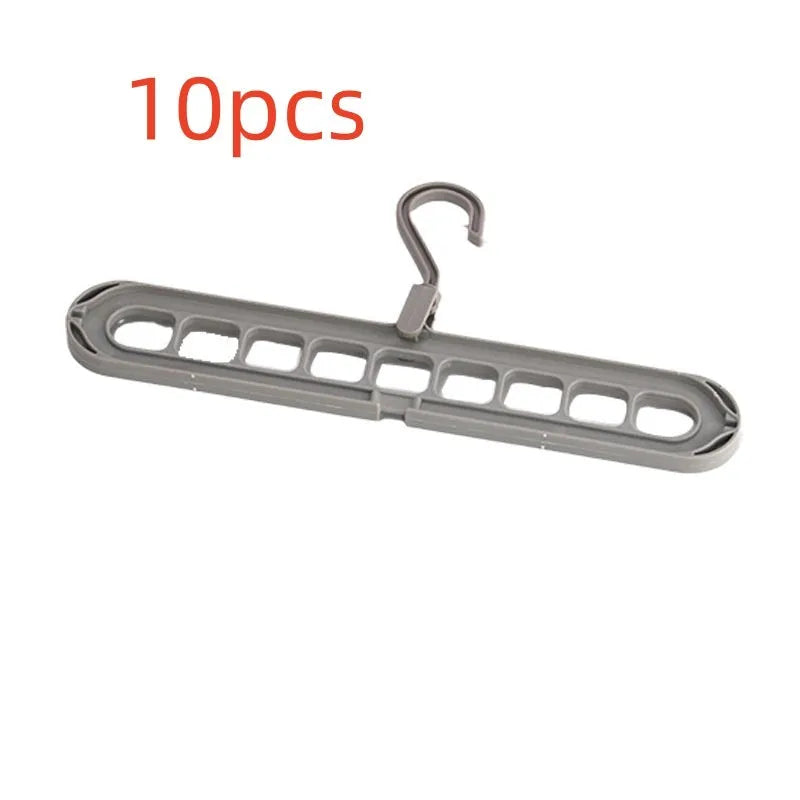 Multifunctional plastic nine-hole folding hanger for trousers, shown in beige, blue, green, pink, and grey colour options.