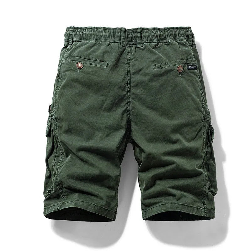 Men's army green cotton shorts with zipper fly and multiple pockets, showcasing Korean-style fit.