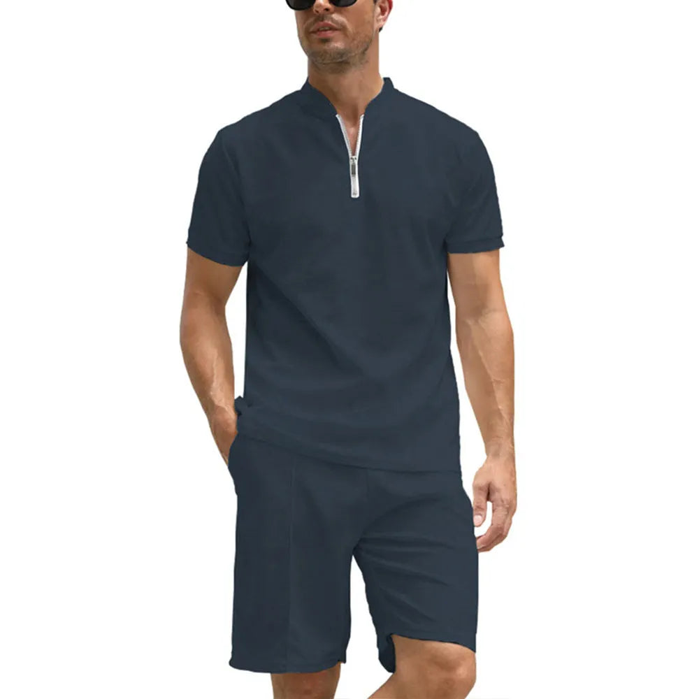 Men's solid colour short sleeve polo shirt and matching trousers two-piece set on a hanger.