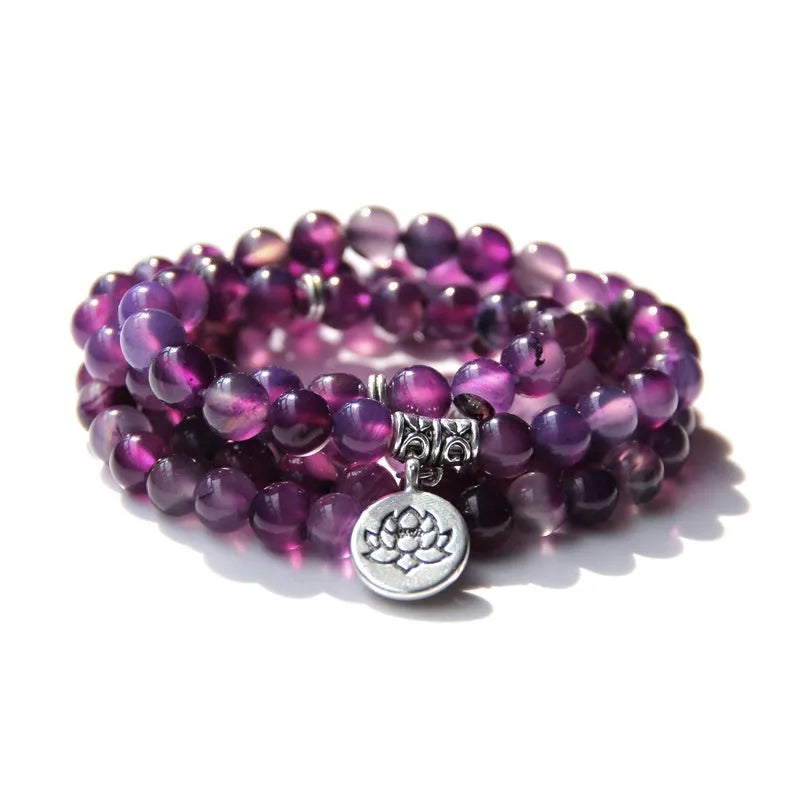 Women's vintage-style bracelet with a natural stone angel echeveria lotus pendant on a chain.