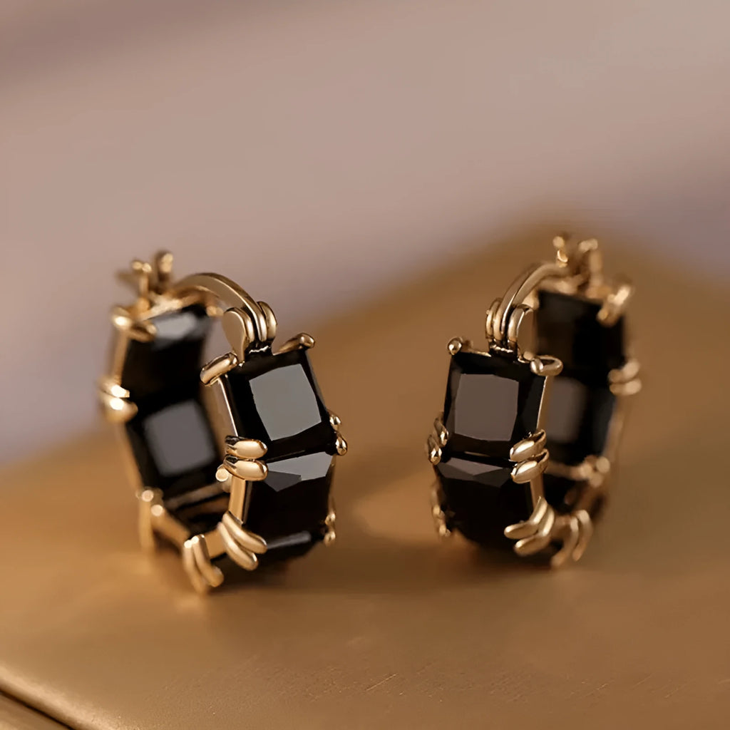 Geometric U-shaped gold ear rings with round black zircon stones