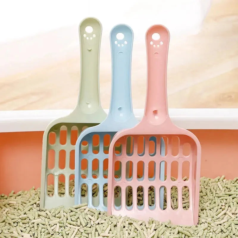 Blue plastic cat litter scoop for cleaning litter trays, 20cm long.