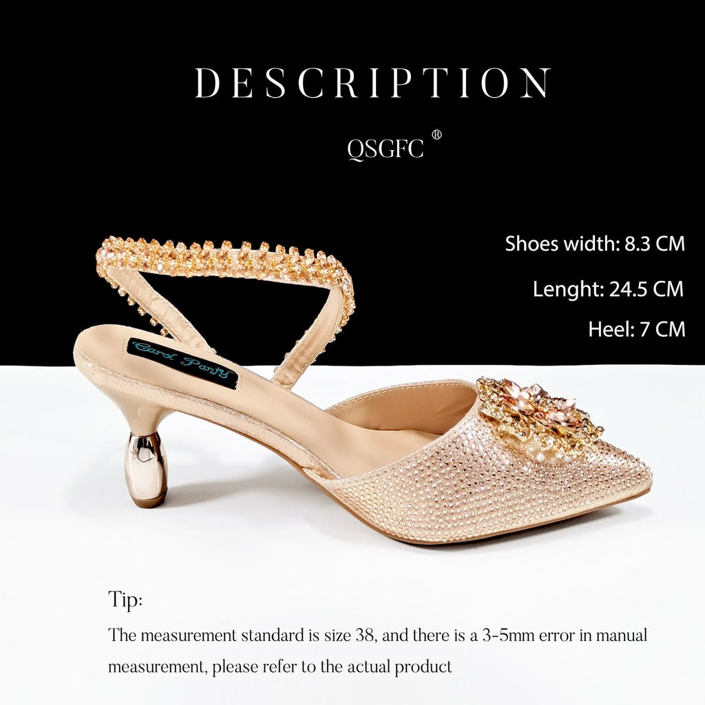 Women's black synthetic leather high heels with ankle chain and matching clutch bag with rhinestone flower decoration