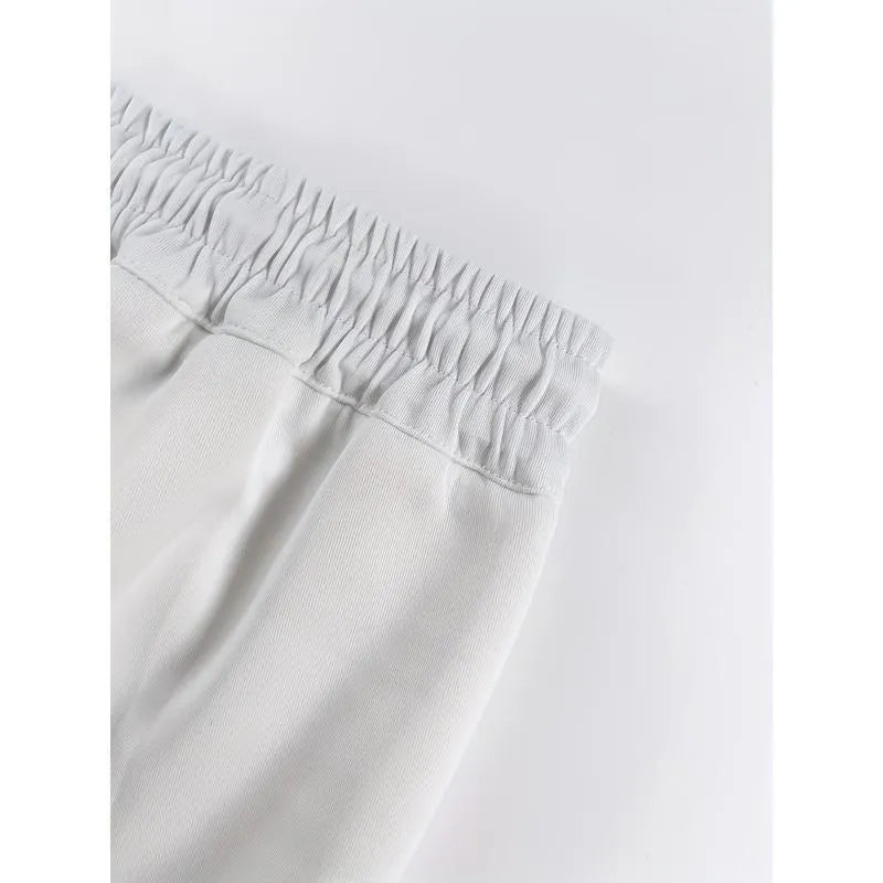 Pack of three men's solid colour loose-fit corduroy trousers on a hanger.
