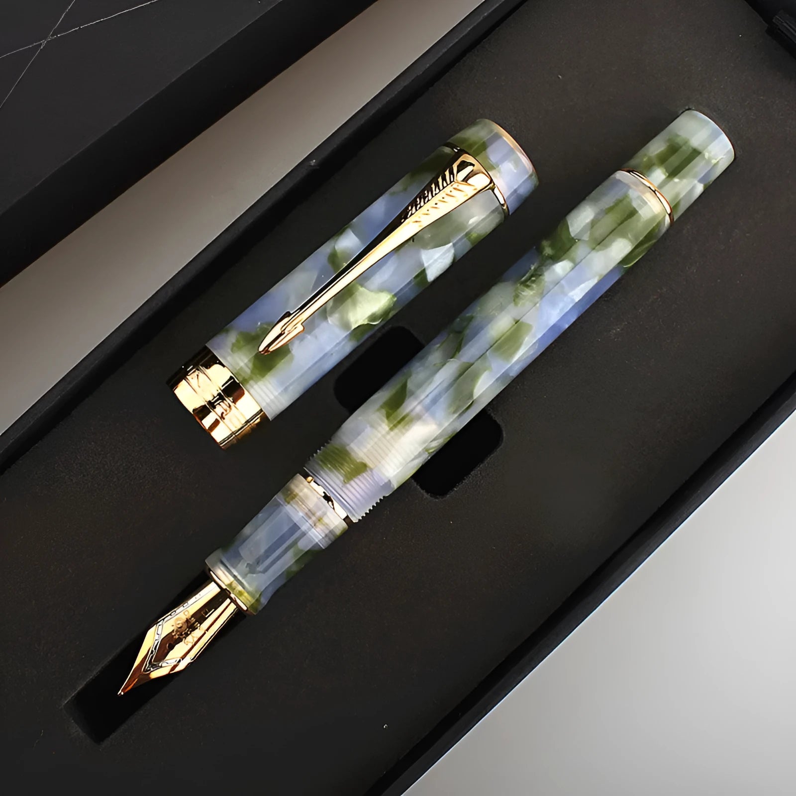 Deep bath green metal fountain pen showing fine, medium and graphic tip options