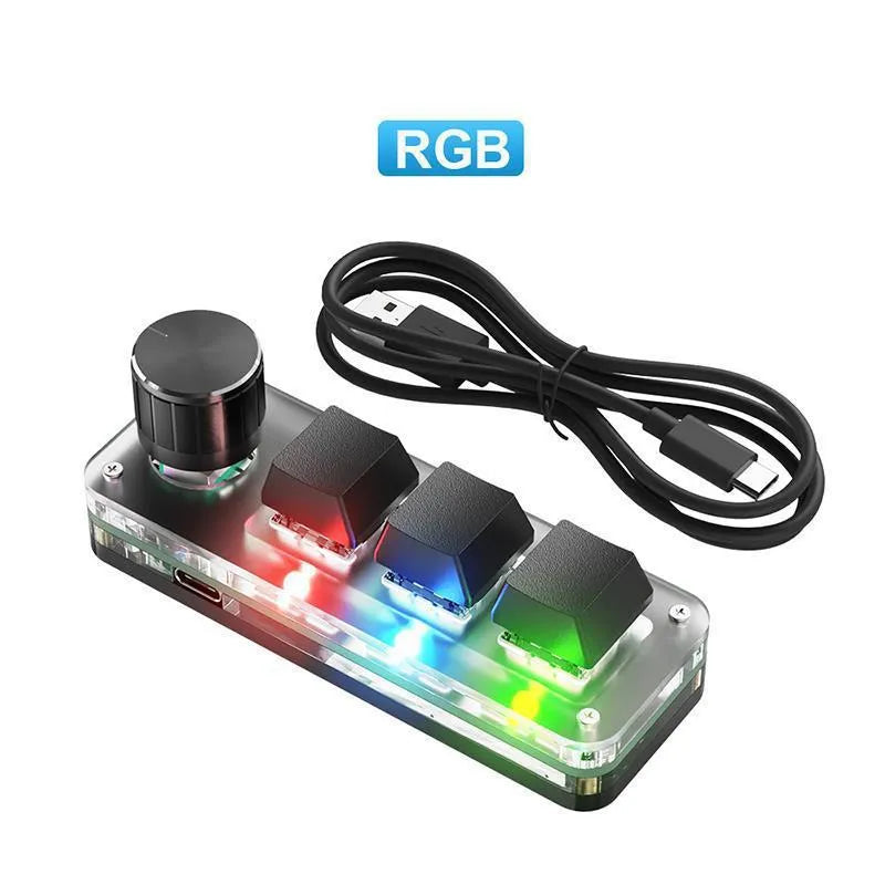 Black custom mechanical keypad with RGB backlighting and dedicated copy paste keys on desk