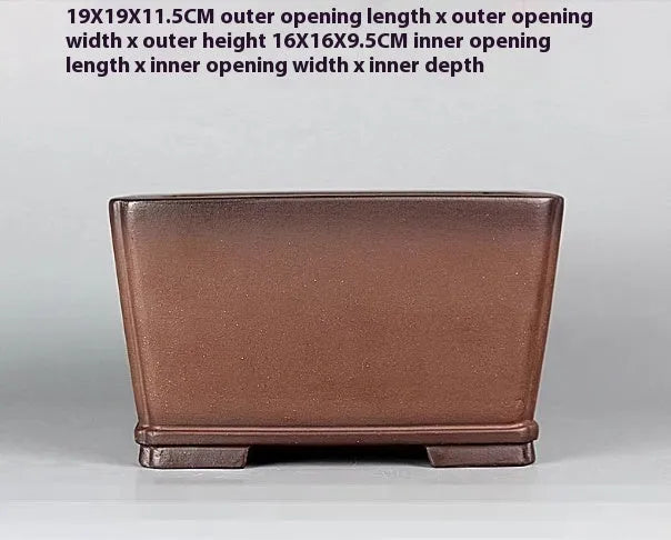 Brown handmade purple clay flower pot measuring 19cm wide with single drainage hole