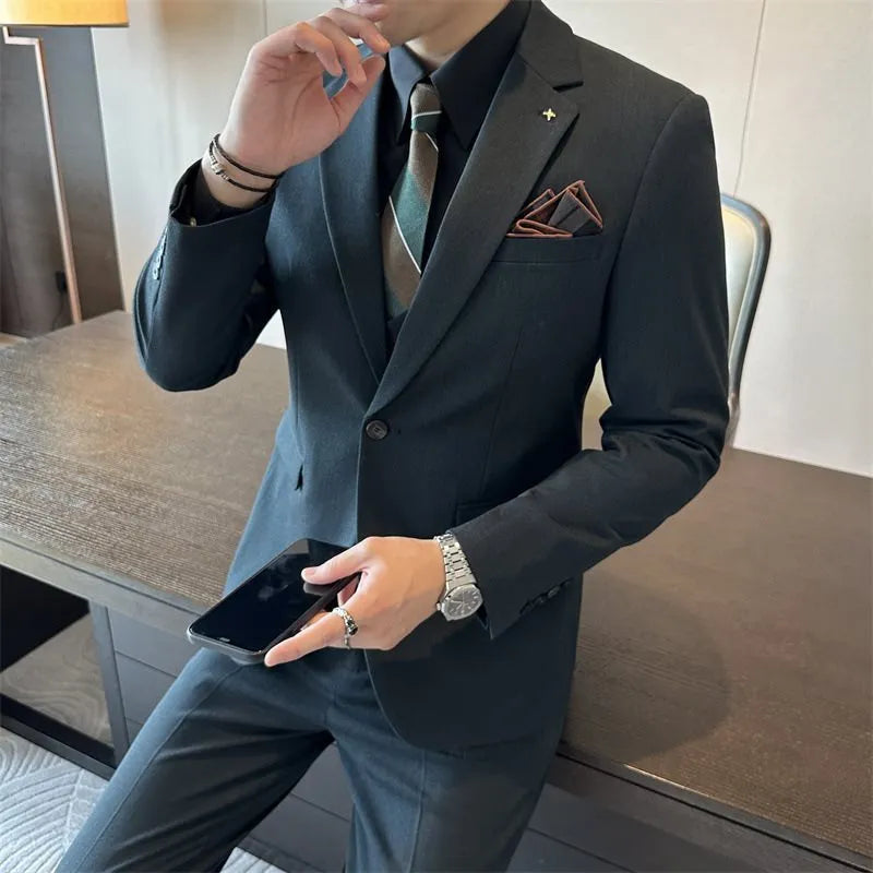Men's slim fit business suit in a dark green viscose-blend fabric on a hanger.