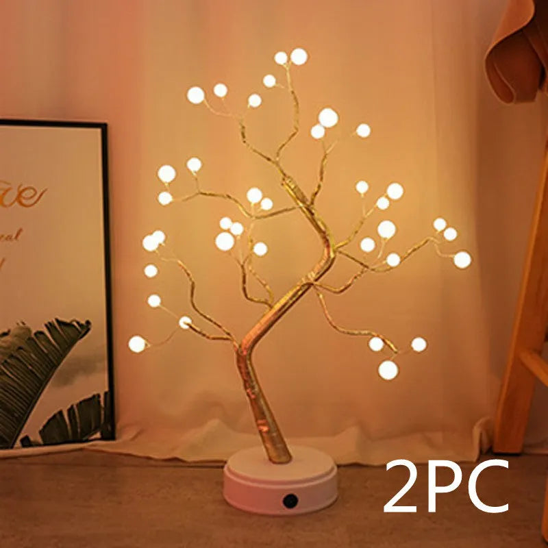 White LED Christmas tree shaped night light with touch base, standing 50cm tall on a table.