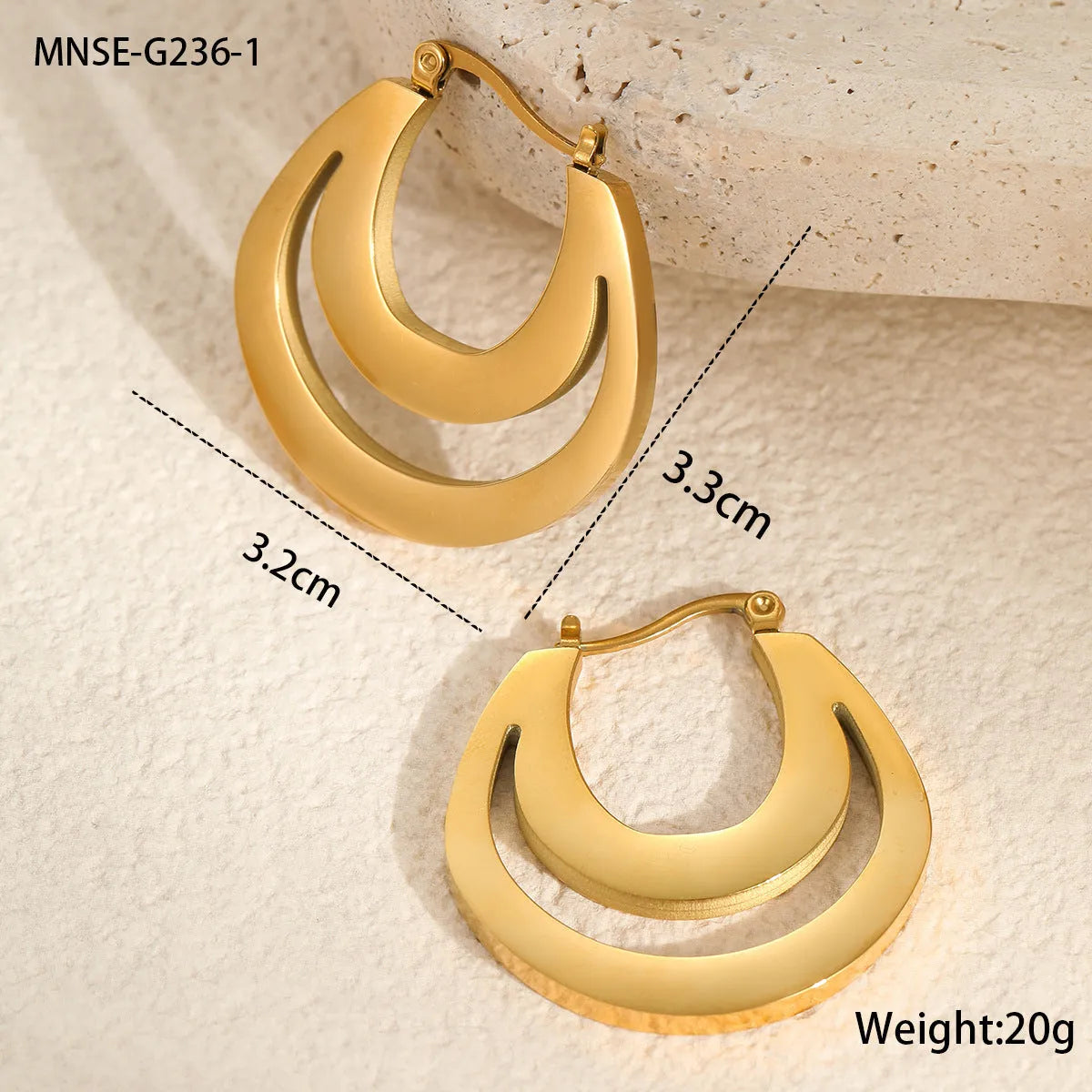 Geometric gold plated hoop earrings with round ring design on stainless steel background