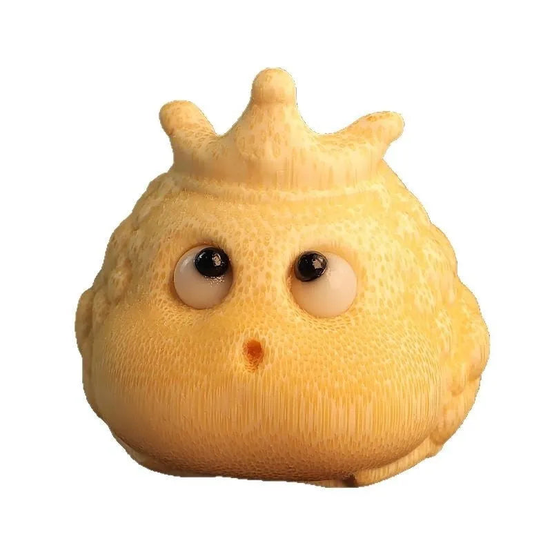 Close-up of a 5 cm cute Crown Princess Toad ornament carved from solid bamboo.