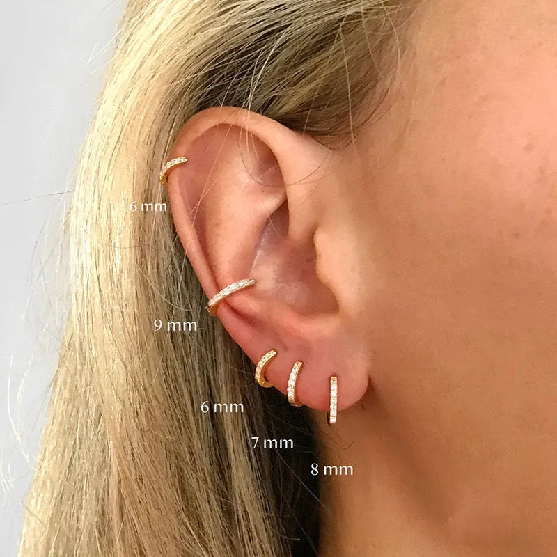 Circle perforated zircon stud earrings in gold, rose gold, and silver colour with geometric design