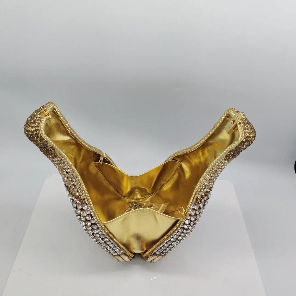 Gold champagne bottle shaped evening clutch with alloy frame measuring 20cm tall