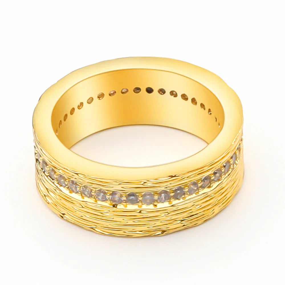 Gold-coloured geometric zircon ring for women showing openwork design and stone detail