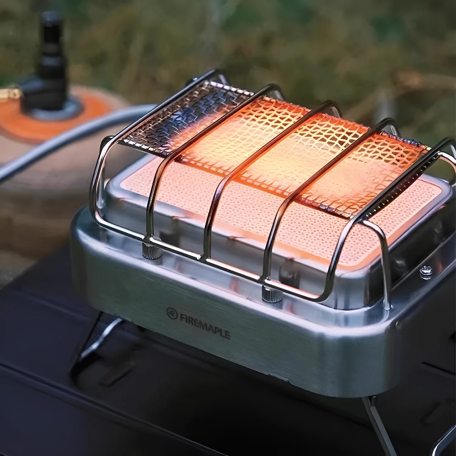 Portable outdoor heating stove with metal finish showing expanded and collapsed sizes