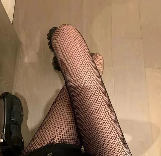 Women's mesh stockings showing large, medium, and small net patterns in black and white colours