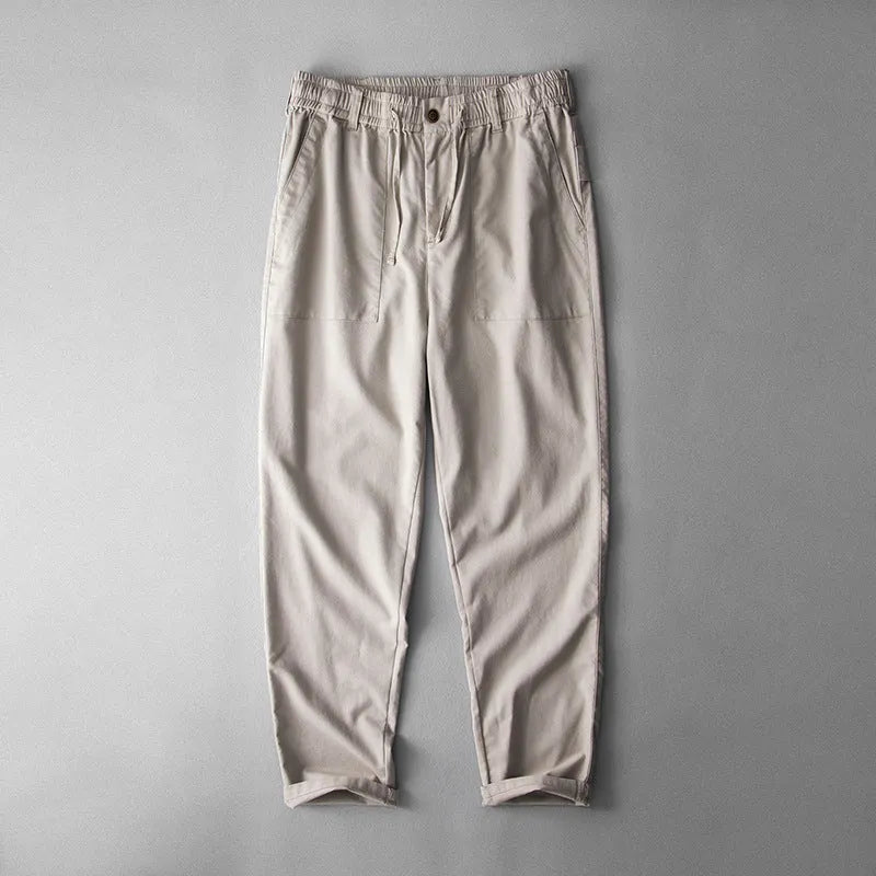 Men's casual linen trousers in a solid colour, shown in a mid-waist, full-length trouser style.