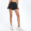 Women's high waist quick-drying nylon fitness shorts in black, shown from the front.