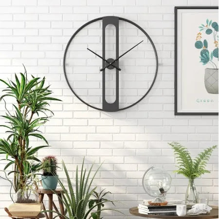 Round metal wall clock with 50cm diameter available in black or gold finish
