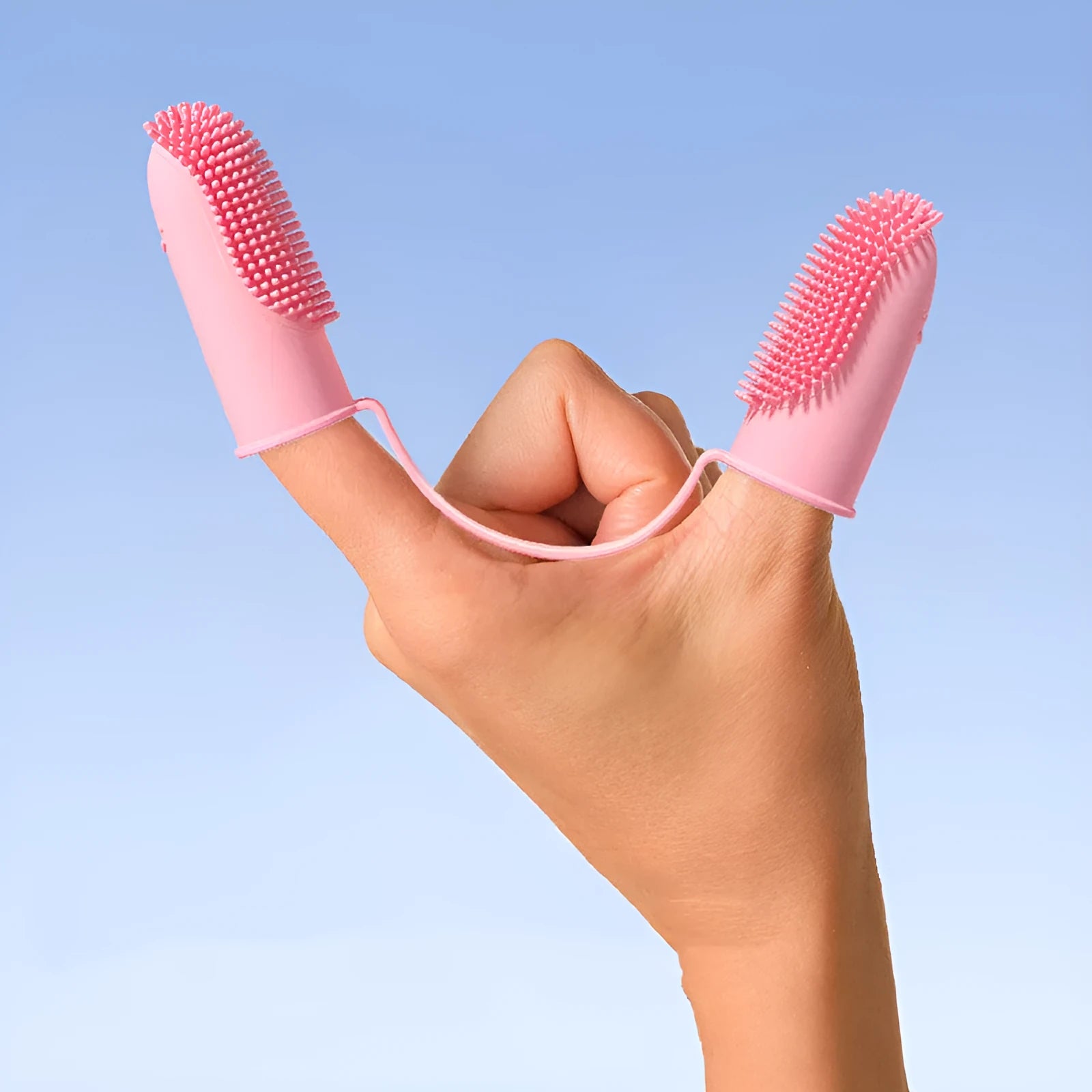 TPR silicone finger toothbrush for pet dental cleaning in blue green, pink, or yellow.