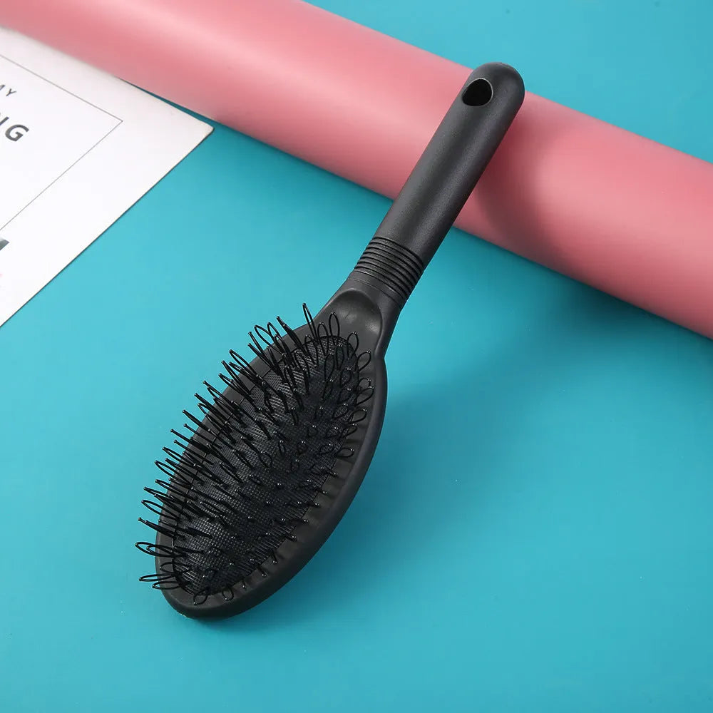 Black and pink plastic hairdressing comb with ring teeth for hair extension application