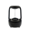 White anti-gravity water droplet humidifier with aromatherapy function on a desk.