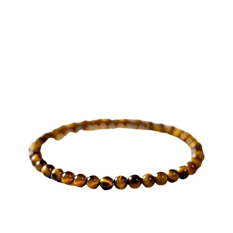 A geometric New Chinese style unisex bracelet made from round Tigereye stone beads.