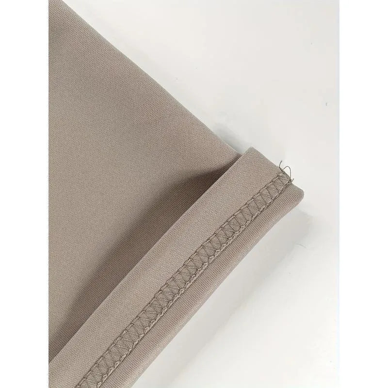 Pack of three men's solid colour loose-fit corduroy trousers on a hanger.