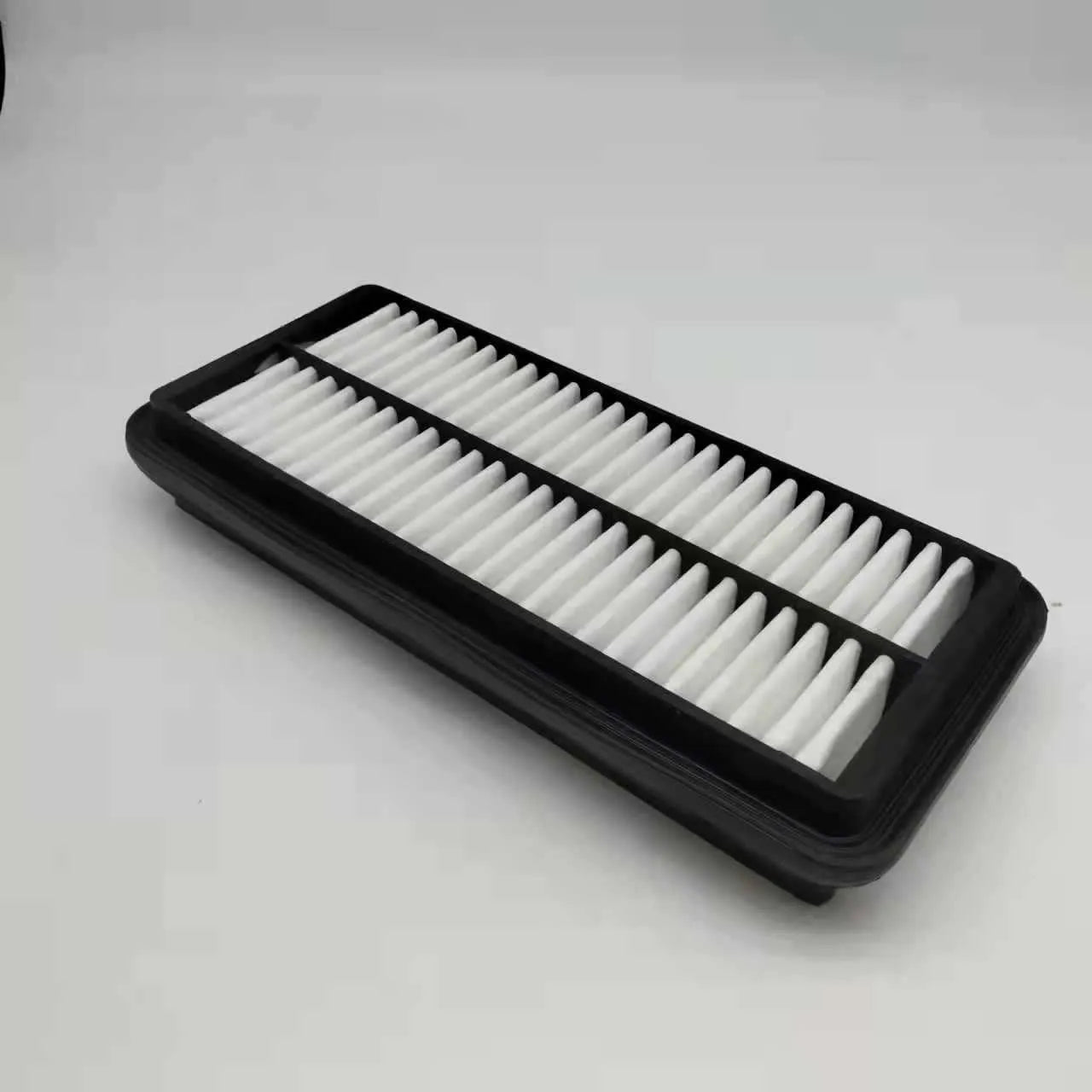 Black polymer car air filter for Hyundai vehicles measuring 256mm x 113mm x 40mm
