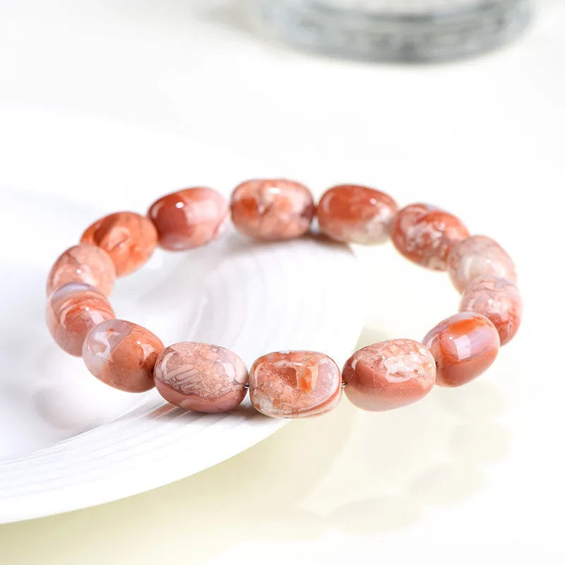 Natural cherry agate bracelet with barrel-shaped beads and ruyi design elements