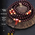 Men's rosewood 108 bead mala bracelet with a turquoise gemstone decorative centrepiece.