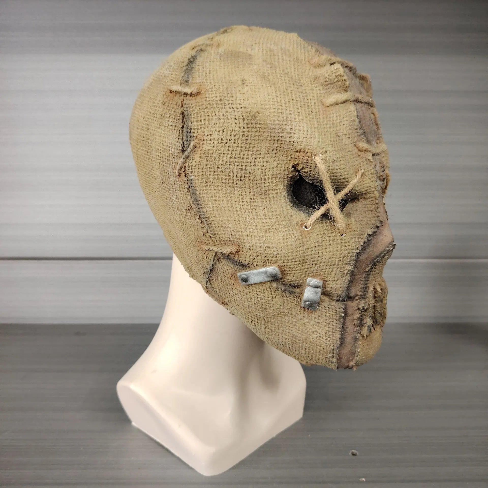 Latex Halloween mask with detailed scar skull design shown from front, suitable for adult wear