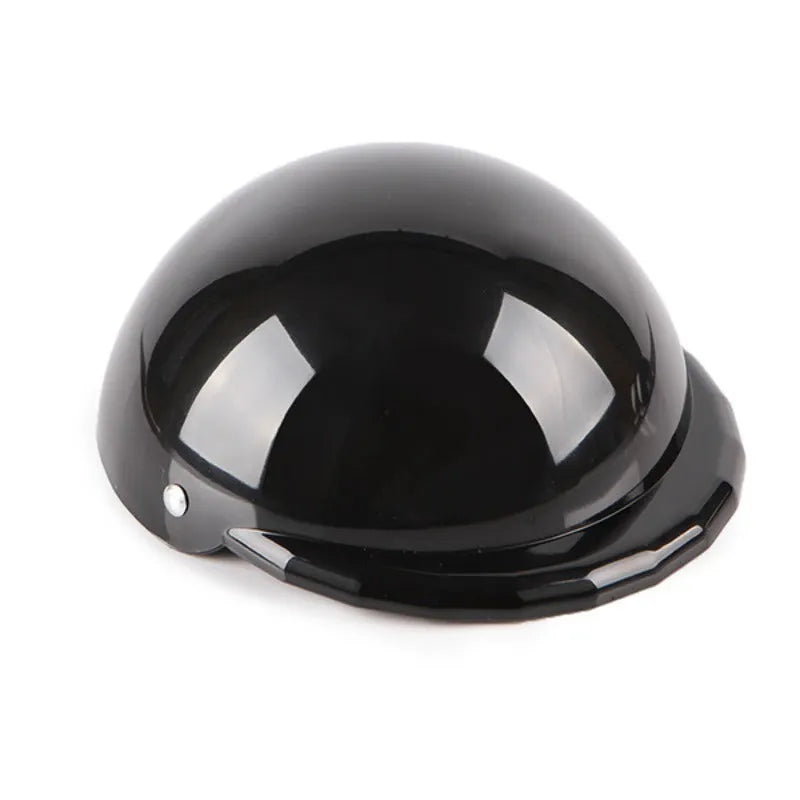 A pink plastic motorcycle cap helmet for a dog, shown alongside white, black, and yellow colour options.