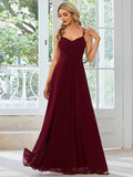 Women's long pleated sleeveless A-line dress in light green, shown on a mannequin.