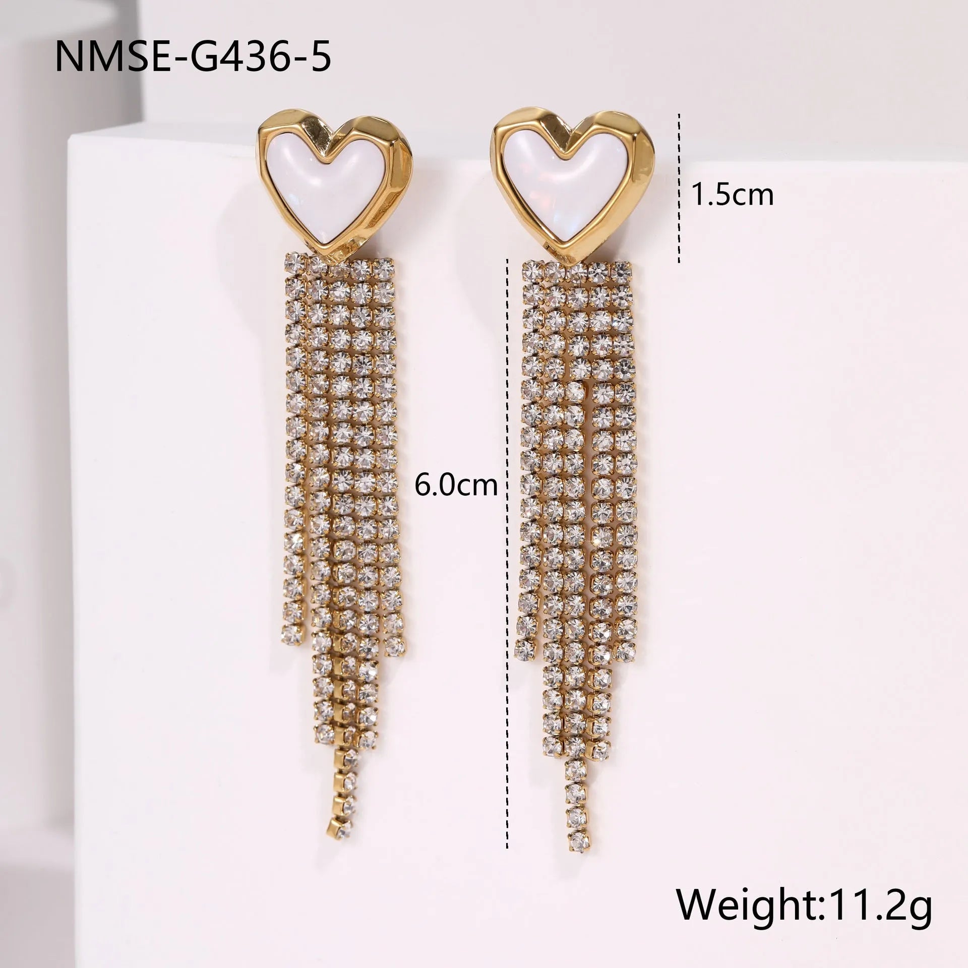Gold plated stainless steel earrings with love heart and star geometric shapes and diamond tassel details