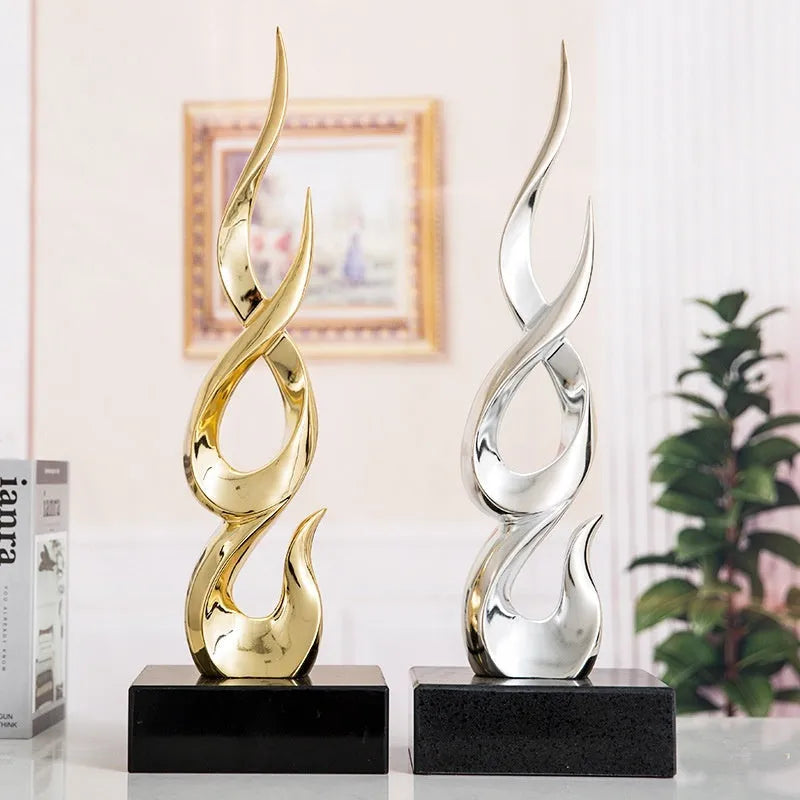 A selection of handmade plastic and resin festival decorations in gold, silver, red, and blue colour options.