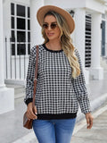 Black long sleeve pullover sweater with printed plaid and stripe pattern on a mannequin